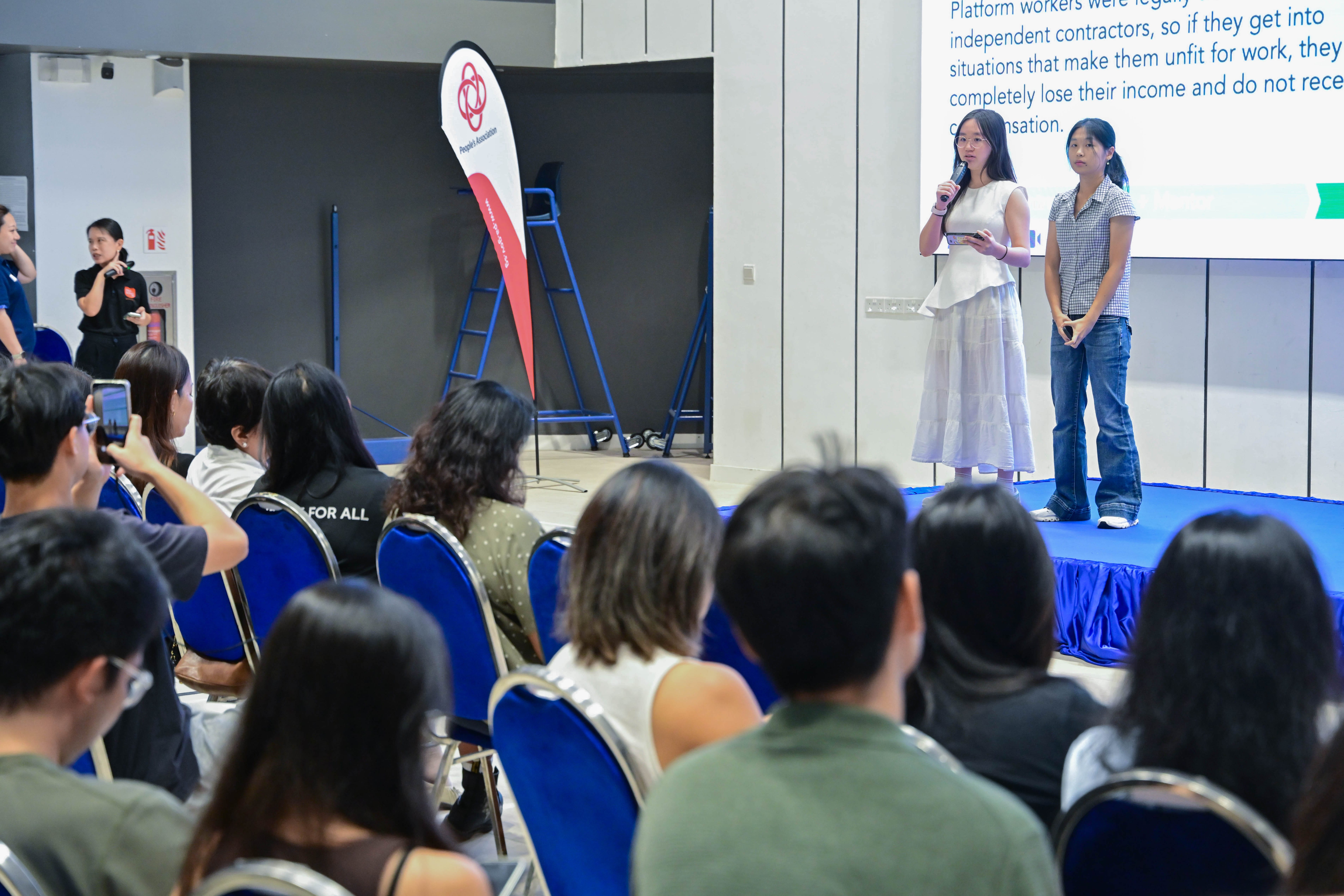 Two students explaining their problem statement relating to platform workers